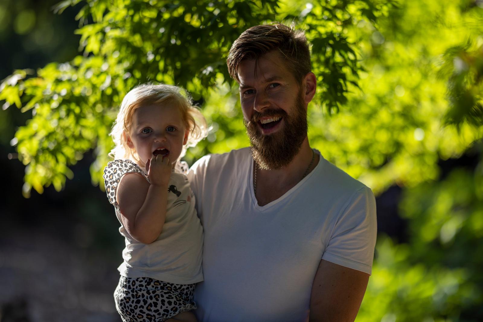 Father and daughter smiling