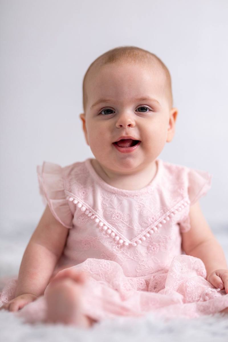 Baby in pink dress